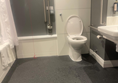 This photo shows the toilet tucked in against the wall and positioned right next to the wash hand basin. The red cord was originally tied up, I managed to untie it and I have placed a Red cord Card on the cord.