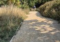 Image of two people on a pathway.