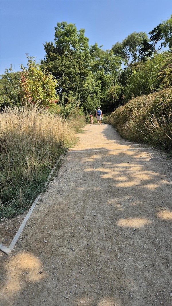 Image of two people on a pathway.