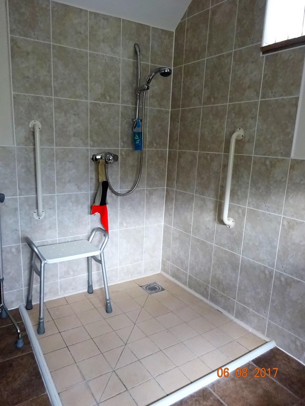 Wet room attached to bedroom with two single beds