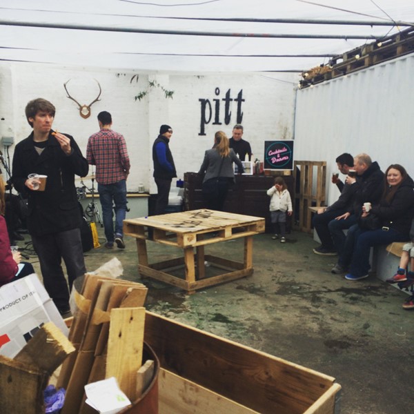 Photo of vendors and people at the Pitt.