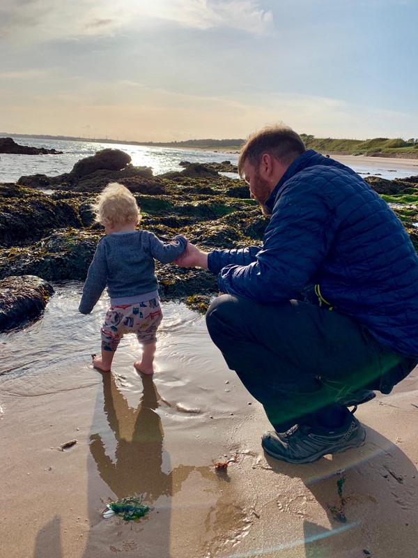 Youngest member of our group paddling in the sea at Homelands.