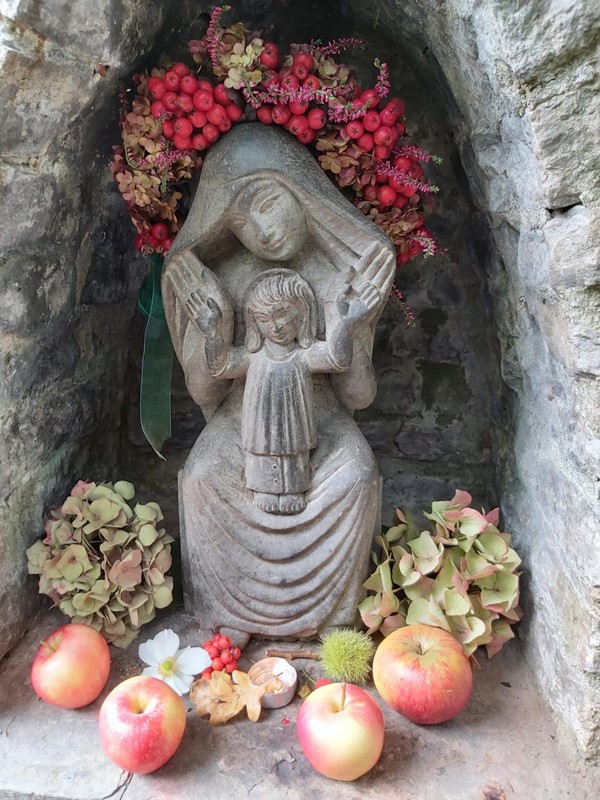 Religious statue and apples
