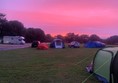 Picture of the campsite with a very red sku