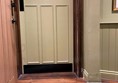Image of a door with a blue circle on the top