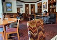 Seats and tables inside the pub