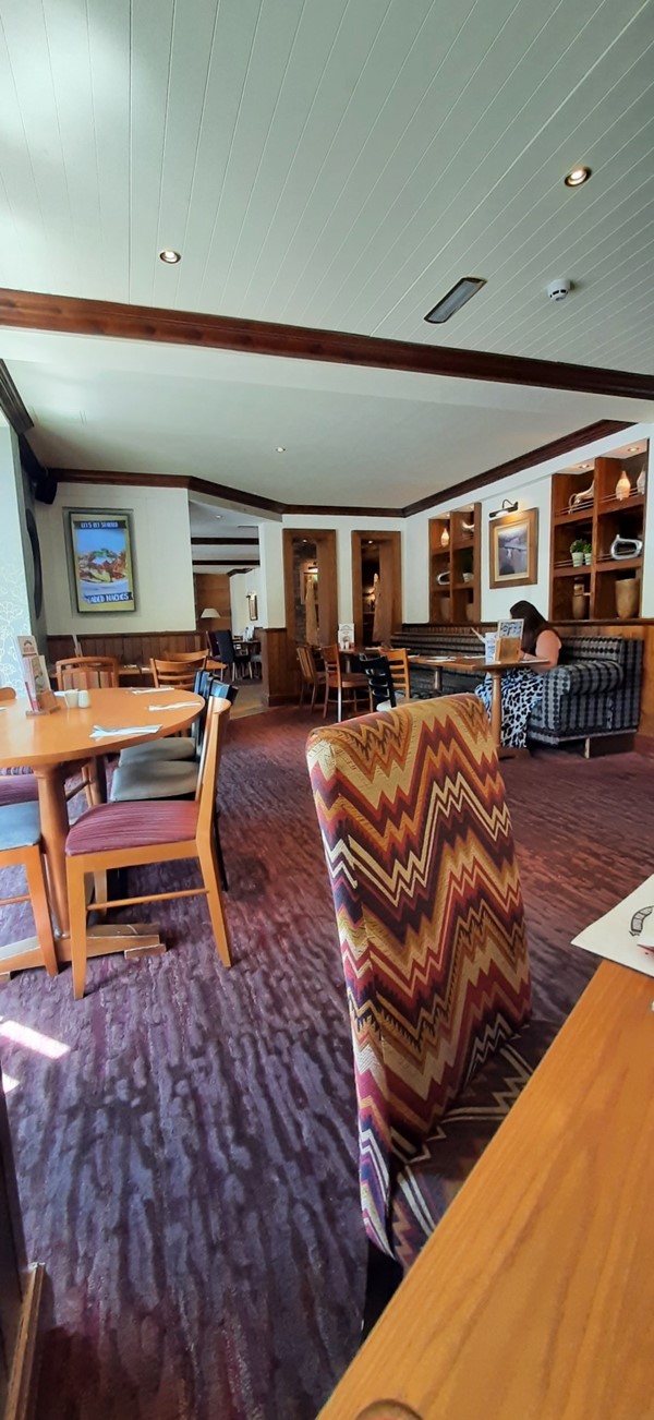 Seats and tables inside the pub