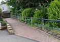 Image of dipped kerb leading up a pathway.