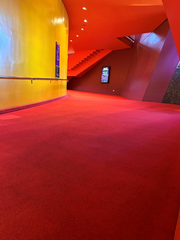 Image of a red carpet in a building