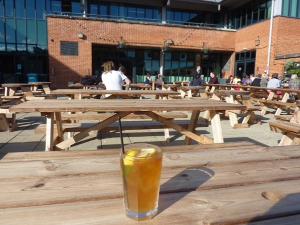 The outside terrace is lovely with lots of wooden tables. They are benches but can be moved around