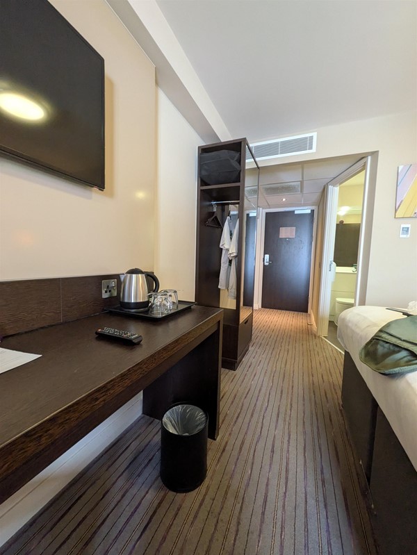Image of foot of bed and desk
