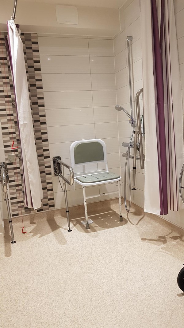 shower chair in Accessible Bathroom - Premier Inn Leeds