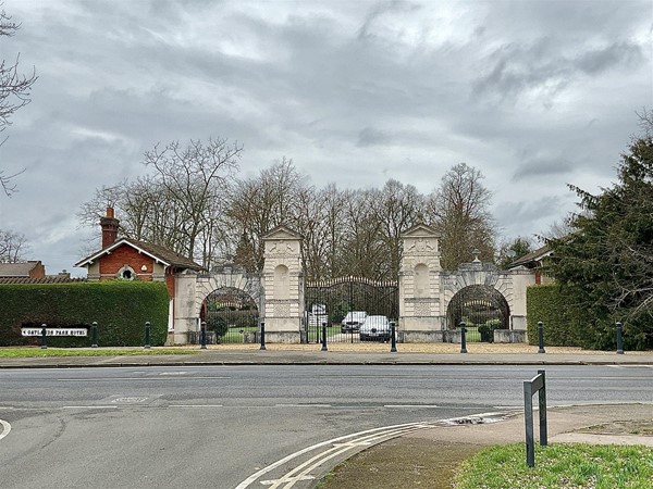 Image of a gate with white brick pillars