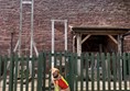 Assistance do in front of a fence