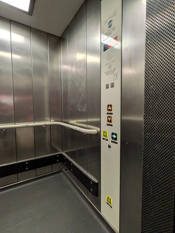 Image of lift access, the lift buttons have braille markings