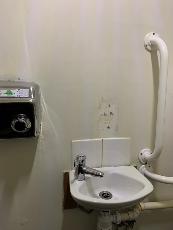 View of sink and hand dryer