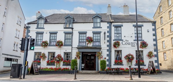 This is the exterior front of the County Hotel, the side entrance, which is accessible to the right hand side, as you look at the photograph up  the sidestreet