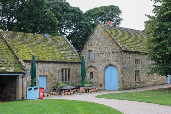 Path from entrance, past shops to restaurant and gardens.