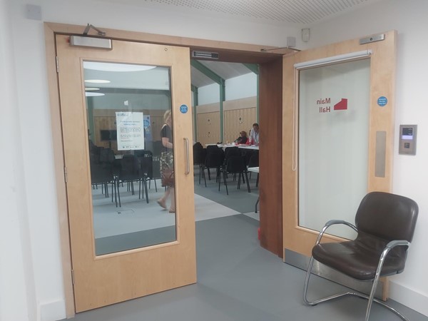 Wide double door marked "Main Hall"