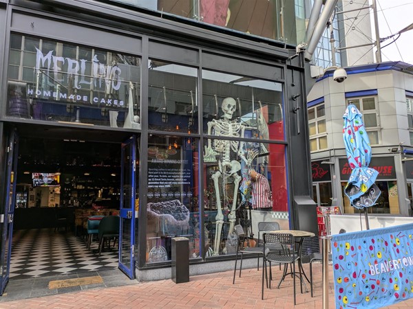 Image of entrance to Merlins