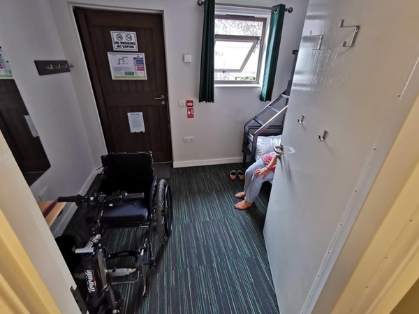 The en-suite accessible room. Just about room to house a wheelchair in front of the door.