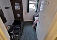 The en-suite accessible room. Just about room to house a wheelchair in front of the door.