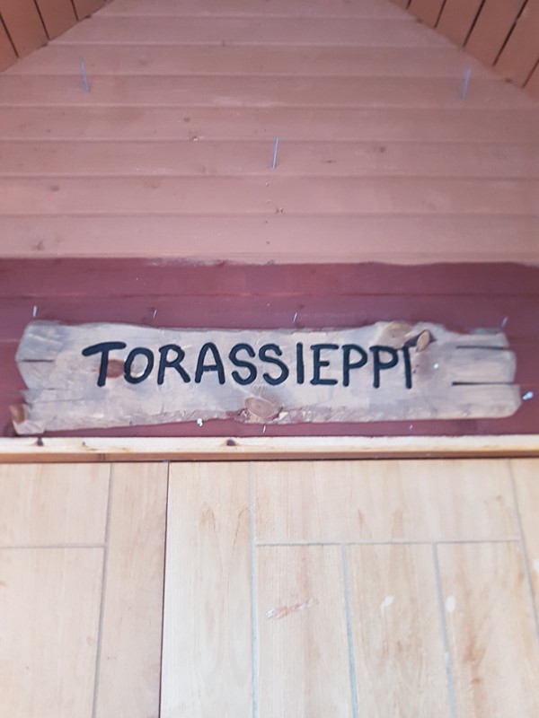 The resort's name carved above the door