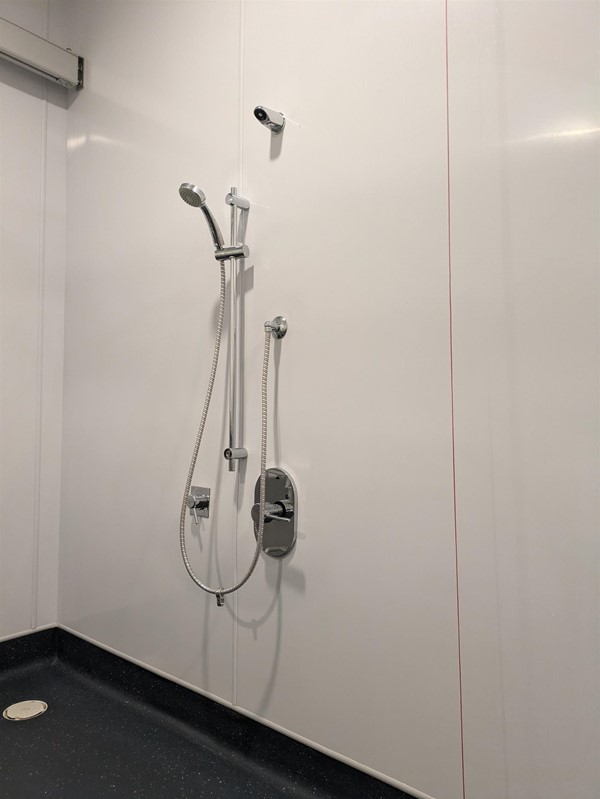 Image of the shower and red cord in the Changing Places toilet
