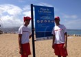 Red Cross assistants on beach
