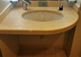 Overlarge toilet sink in accessible bathroom