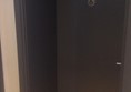 Door to accessible loo in separate corridor.