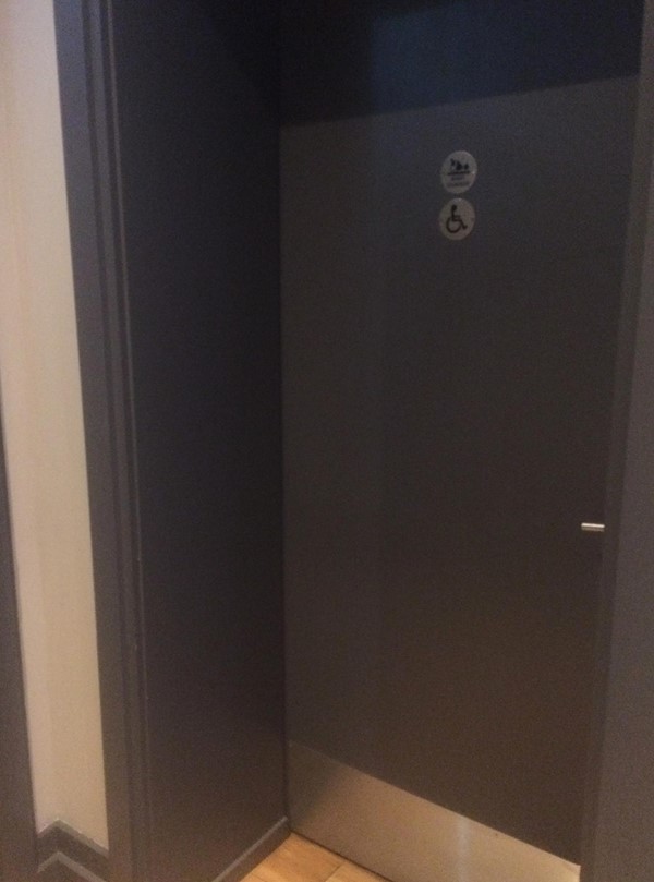 Door to accessible loo in separate corridor.