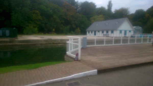 Decked seating area with ramp access opposite stage.