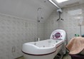 Jacuzzi bathroom with ceiling hoist