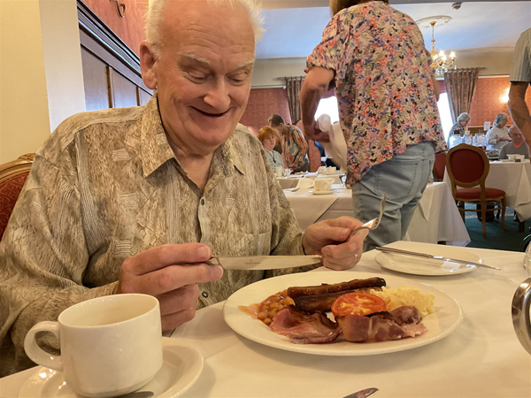 Image of someone eating breakfast