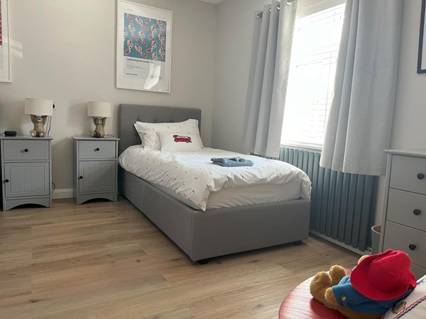Image of one of the beds in one of the standard bedrooms.