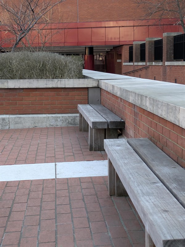Image of wooden benches in the courtyard