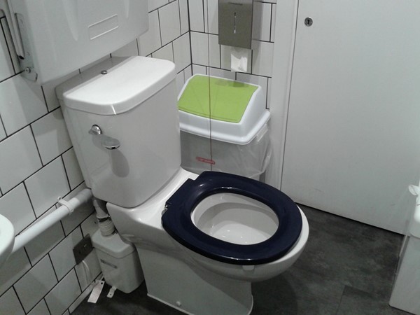 Toilet on the same level as the restaurant