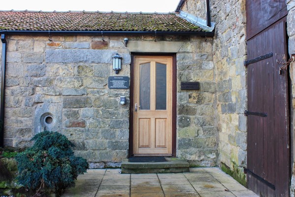 Entrance to swimming pool with a large step and then a lip around the doorway. Narrow door would make it more difficult.