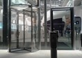 Accessible entrance to the right of revolving door