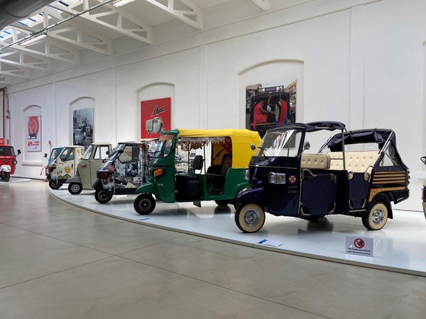 Image of a row of vehicles on display.
