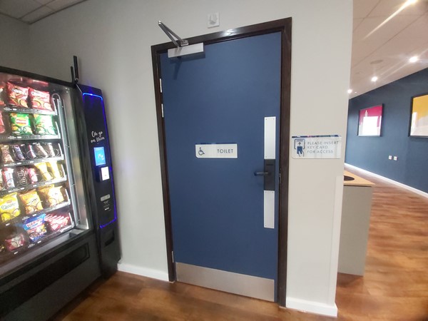 Image of an accessible toilet door