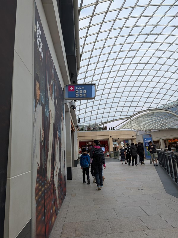 image of wall-mounted sign to the first floor toilets