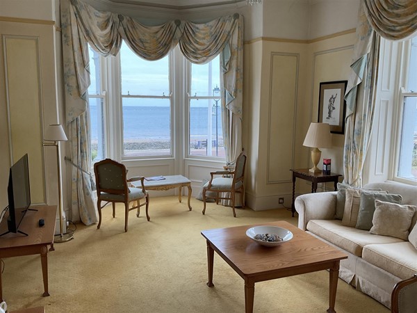 Image of a bay window looking out to the sea