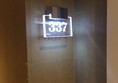 Illuminated door numbers with braille