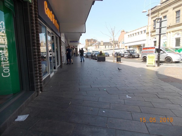 This is the area to left of the store as you exit that has Blue Badge Parking