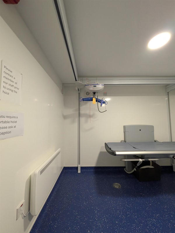 Image of Adjustable change bed and wet room style flooring