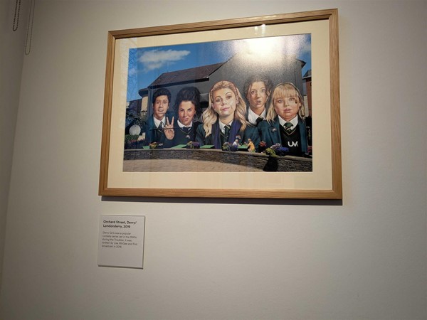 Image of a framed picture of a mural of the cast of the show Derry Girls