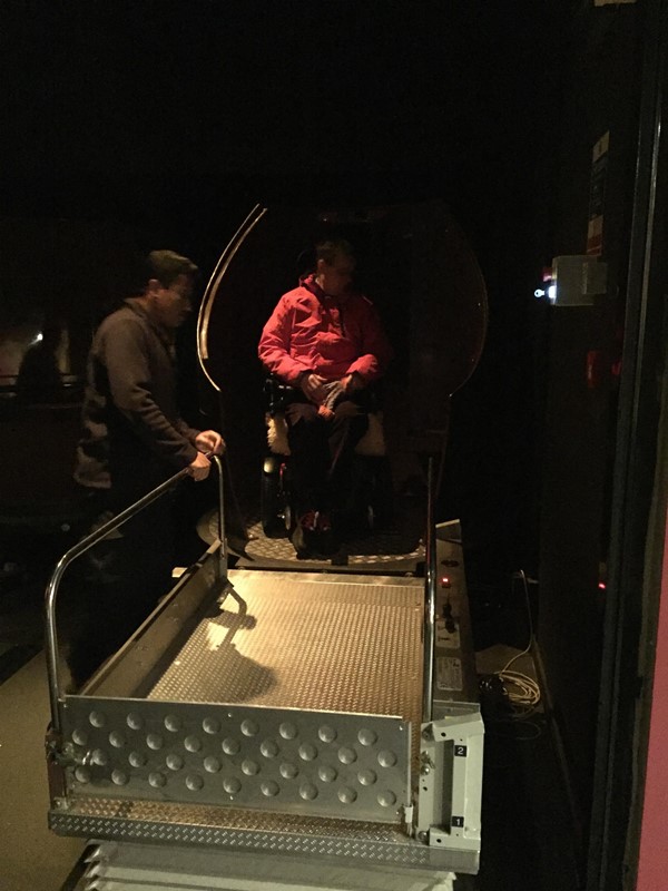 Picture of The Scotch Whisky Society - Wheelchair user using the platform lift to get on the Barrel ride