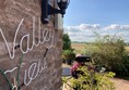 Level patio, which gets the sun in the afternoon and has wonderful views of the valley.